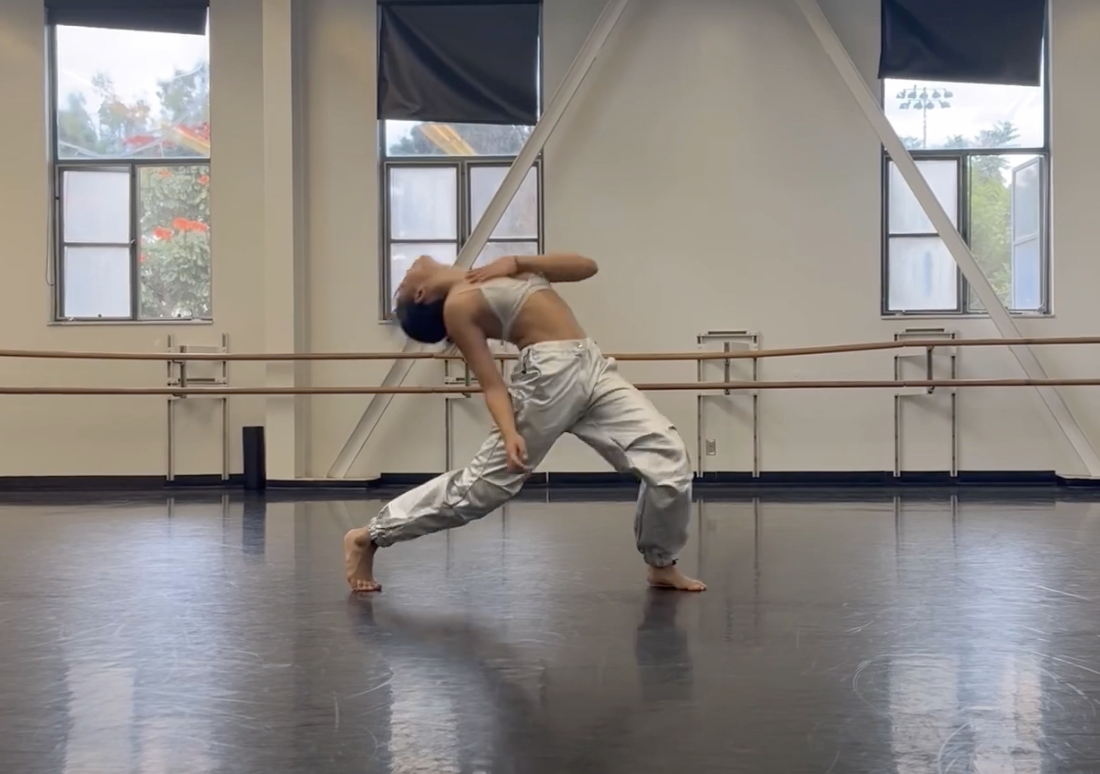 a dancer bending backwards in mid dance routine